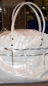 white cowhide carryall