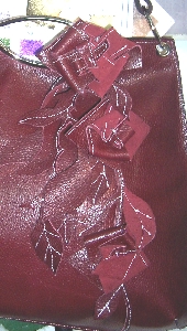 burgundy cowhide rose bag